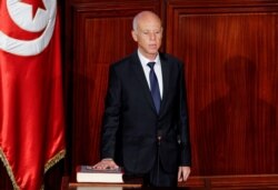 FILE - Tunisian President Kais Saied takes the oath of office in Tunis, October 23, 2019.