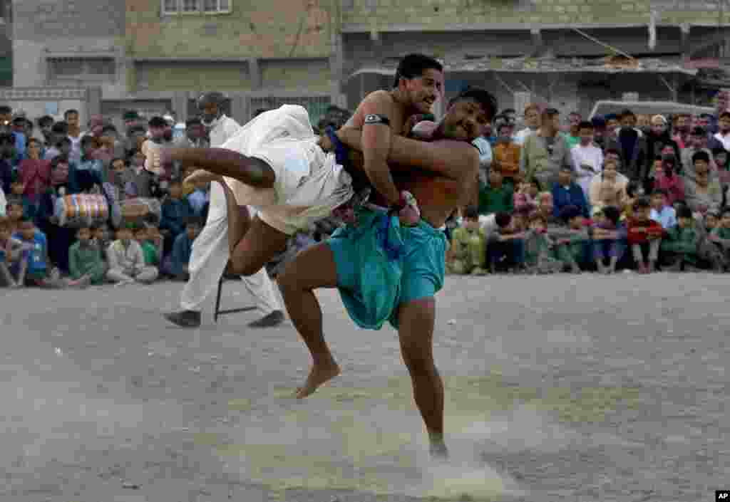 Wrestlers compete in an ancient Sindhi form of wrestling called &quot;Malakhra&quot; in Karachi, Pakistan.