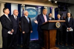 President Donald Trump, center, with members of the president's coronavirus task force speaks during a news conference at the Brady press briefing room of the White House, Feb. 26, 2020, in Washington.