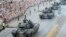 Tanks roll on one of the city's main streets during a yearly military parade celebrating the Polish Army Day in Warsaw, Poland, Aug. 15, 2018. 
