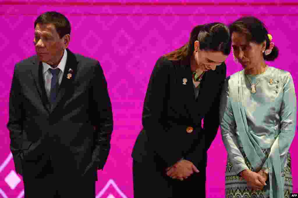 Myanmar&#39;s State Counsellor Aung San Suu Kyi (R) talks to New Zealand&#39;s Prime Minister Jacinda Ardern next to Philippines&#39; President Rodrigo Duterte (L) during the 14th East Asia Summit in Bangkok, Thailand.