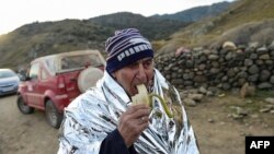 پیاوێکی پەنابەری سوریایی پاش گەیشتنی بۆ دوورگەی لیسبۆسی یۆنان، 16 ی 11ی ساڵی 2015