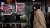 A person peeks into a U.S. election watch at a restaurant in Taipei, Taiwan, November 6, 2024. 