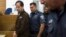 Iranian-Belgian citizen Ali Mansouri is seen arriving at a courtroom at the magistrate's court in Petah Tikva near Tel Aviv September 30, 2013.