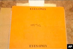 This image, contained in the report from special counsel Robert Hur, shows the envelope labeled "Eyes Only" with a handwritten note reading "VPOTUS" that contained classified documents housed at the Penn Biden Center in Washington. (Justice Department via AP)