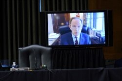 FILE - Sen. Pat Toomey, R-Pa., speaks via video conference during a hearing on Capitol Hill in Washington, Dec. 1, 2020.