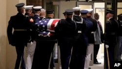 Pallbearers carry the casket containing the body of the late Rep. Elijah Cummings ahead of his funeral at New Psalmist Baptist Church, in Baltimore, Maryland, Oct. 25, 2019.