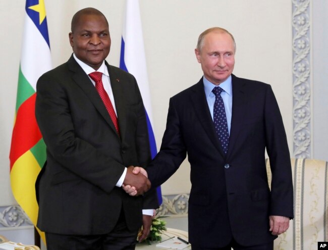 Russian President Vladimir Putin, right, shakes hands with Central African Republic President Faustin-Archange Touadéra, in St. Petersburg, Russia, Wednesday, May 23, 2018.