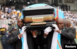 Pallbearers carry the casket with the remains of Etienne Tshisekedi, former Congolese opposition figure who died in Belgium two years ago, at the Martyrs of Pentecost Stadium in Kinshasa, Democratic Republic of Congo May 31, 2019.