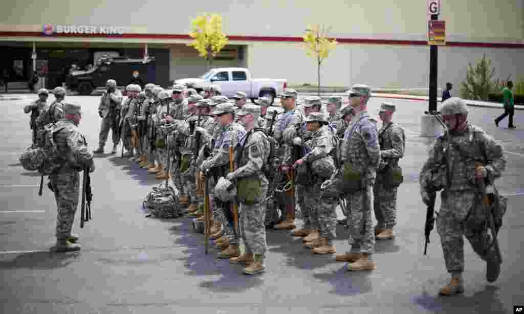Members of the National Guard gather at the Mondawmin Mall, where looting occurred during a riot, in Baltimore, April 29, 2015.