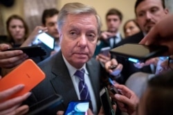 FILE - Senate Judiciary Committee Chairman Lindsey Graham, R-S.C., is surrounded by reporters on Capitol Hill in Washington, Feb. 25, 2020.