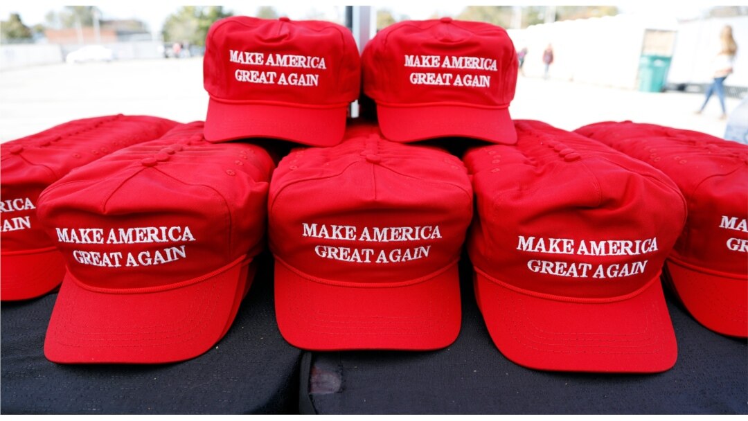 FILE - "Make America Great Again" hats available for purchase outside an arena in Tupelo, Miss., Nov. 1, 2019, ahead of a Keep America Great rally.