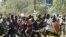Supporters of Orange Democratic Movement (ODM) run as riot police chase them in Nairobi, Kenya, December 31, 2007.