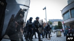 French riot police officers patrol during a demonstration in Caen, north-western France on June 30, 2023, after the shooting of a teenage driver by French police in a Paris suburb on June 27.