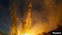 The Soyuz MS-11 spacecraft carrying the crew formed of David Saint-Jacques of Canada, Oleg Kononenko of Russia and Anne McClain of the U.S. blasts off to the International Space Station, Kazakhstan Dec. 3, 2018.