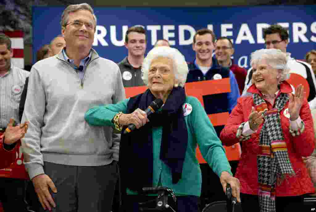 Barbara Bush, center, jokes with her son, Republican presidential candidate, former Florida Gov. Jeb Bush, while introducing him at a town hall meeting at West Running Brook Middle School in Derry, N.H., Feb. 4, 2016.