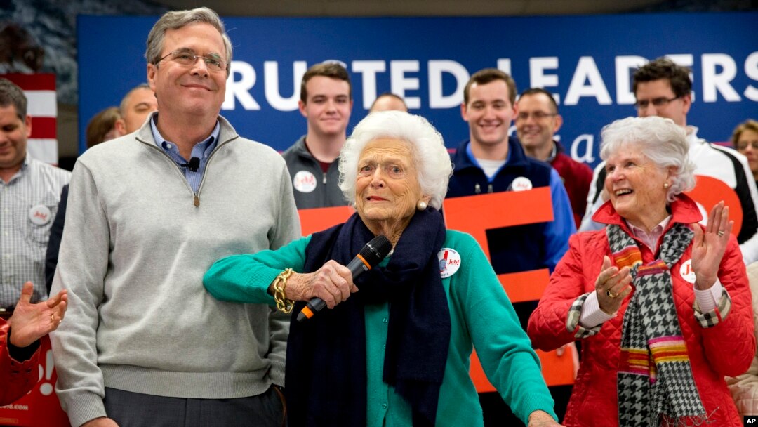 FILE - Barbara Bush, center, jokes with her son, Republican presidential candidate, former Florida Gov. Jeb Bush, while introducing him at a town hall meeting at West Running Brook Middle School in Derry, N.H., Feb. 4, 2016.