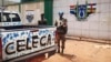 A fighter from the Seleka rebel coalition stands guard in front of the abandoned South African military camp in Bangu on March 25, 2013.