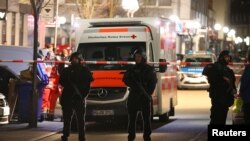 Police officers secure an area after a shooting in Hanau, near Frankfurt, Germany, Feb. 20, 2020. 