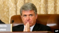 FILE - House Homeland Security Committee Chairman Michael McCaul, a Texas Republican, listens during a committee hearing on Capitol Hill in June 2014.