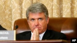 FILE - House Homeland Security Committee Chairman Michael McCaul, R-Texas, listens during a committee meeting in June 2014 on Capitol Hill.