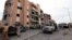 Libyan forces allied with the U.N.-backed government gather in front of ruined buildings at the eastern frontline of fighting with Islamic State militants, in Sirte's neighborhood 650, Libya, Oct. 21, 2016. The six-month fight to oust Islamic State has destroyed much of the city.