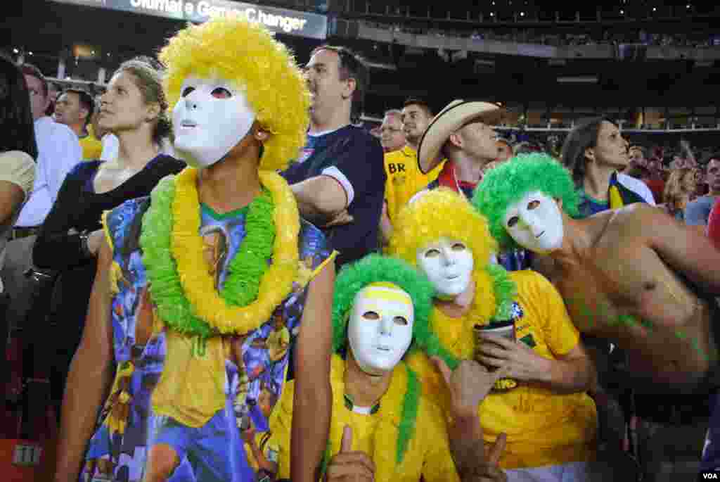 Brazil fans prefer to remain anonymous as they watch their team dominate the USA. VOA/M. Lipin