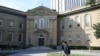 FILE - A student walks in front of the University of Toronto, St. George campus, in Toronto, Sept. 26, 2023.