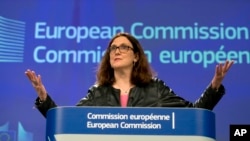 FILE - European Commissioner for Trade Cecilia Malmstroem speaks during a media conference at EU headquarters in Brussels, March 7, 2018. The European Union has been developing its strategy on how to counter U.S. tariffs on steel and aluminum.