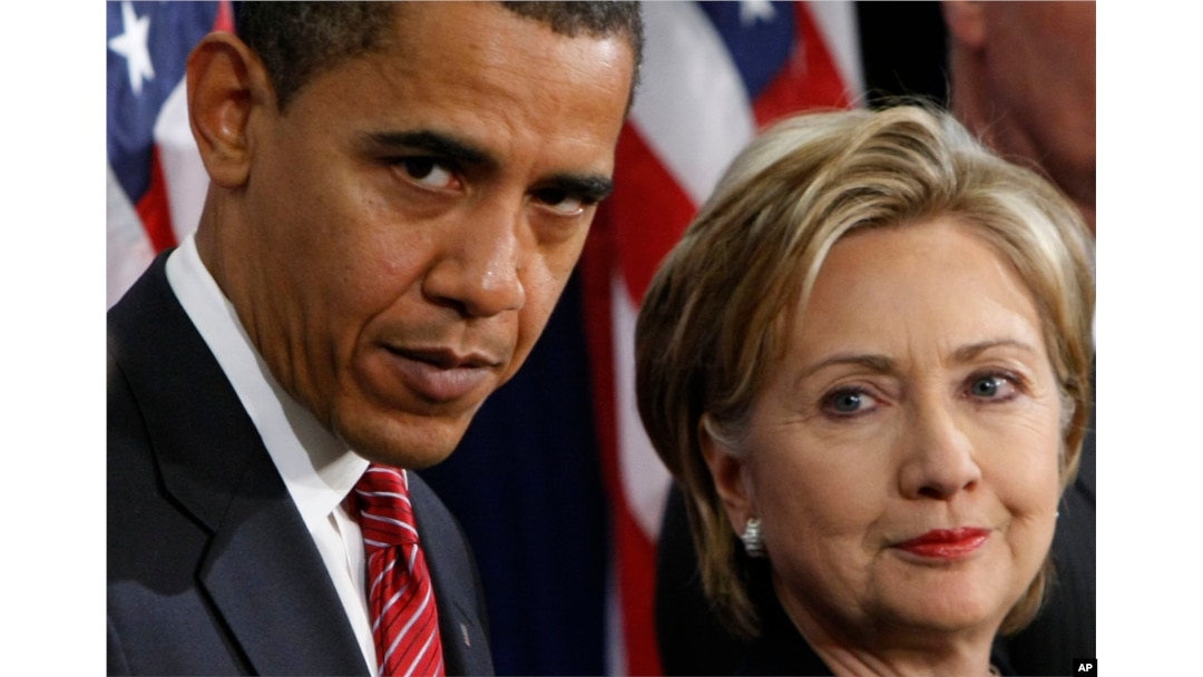 FILE - In this Dec. 1, 2008, file photo, then-President-elect Barack Obama, left, stands with then-Sen. Hillary Rodham Clinton, D-N.Y., after announcing that she is his choice as Secretary of State during a news conference in Chicago.
