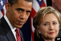 FILE - In this Dec. 1, 2008, file photo, then-President-elect Barack Obama, left, stands with then-Sen. Hillary Rodham Clinton, D-N.Y., after announcing that she is his choice as Secretary of State during a news conference in Chicago.