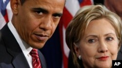 FILE - Then-President-elect Barack Obama stands with then-Sen. Hillary Clinton, D-N.Y., after announcing that she was his choice as secretary of state during a news conference in Chicago, Dec. 1, 2008.