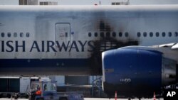 A damaged British Airways Boeing 777-200 sits at McCarran International Airport Wednesday, Sept. 9, 2015, in Las Vegas.