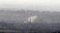 Smoke rises after shells exploded in the Syrian village of al-Rafeed, close to the cease-fire line between Israel and Syria, as seen from the Israeli occupied Golan Heights May, 7, 2013. 
