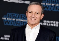 FILE - Disney CEO Robert Iger arrives at the world premiere of "Star Wars: The Rise of Skywalker," in Los Angeles, Dec. 16, 2019.