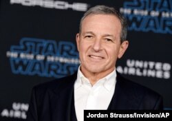 FILE - In this Dec. 16, 2019, file photo, Disney CEO Robert Iger arrives at the world premiere of "Star Wars: The Rise of Skywalker", in Los Angeles The Walt Disney Co. has named Bob Chapek CEO, replacing Bob Iger, effective immediately, the…