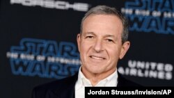 FILE - In this Dec. 16, 2019, file photo, Disney CEO Robert Iger arrives at the world premiere of "Star Wars: The Rise of Skywalker", in Los Angeles.