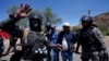 Police detain supporters of former President Evo Morales who were blocking roads to prevent Morales from facing a criminal investigation over allegations of abuse of a minor while in office, in Parotani, Bolivia, Nov. 1, 2024.