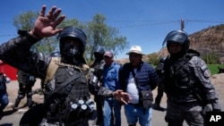 Police detain supporters of former President Evo Morales who were blocking roads to prevent Morales from facing a criminal investigation over allegations of abuse of a minor while in office, in Parotani, Bolivia, Nov. 1, 2024.