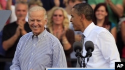 President Barack Obama, right, with Vice President Joe Biden, at campaign rally Oct. 23, 2012, in Dayton, Ohio