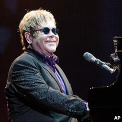 British singer Elton John performs in concert at the Ricardo Saprissa stadium in San Jose, Costa Rica, Feb. 3, 2012. T