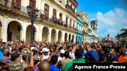 (FILES) In this file photo taken on July 11, 2021, people take part in a demonstration against the government of Cuban President Miguel Diaz-Canel in Havana.