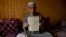 Ghulam Mohammad Zargar, an elderly Kashmiri man shows his domicile document locally know as "State Subject" which was only held by permanent residents of Jammu and Kashmir in Srinagar, Indian controlled Kashmir, Oct. 31, 2019.