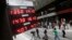 An electronic board shows the exchange rate of several currencies in relation to Argentina's peso, outside an exchange bureau in Buenos Aires, Argentina, Dec. 17, 2015.