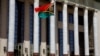 FILE - A Vanuatu flag flutters outside the Great Hall of the People in Beijing, May 27, 2019. The prime ministers of the Solomon Islands and Vanuatu are visiting China this week.