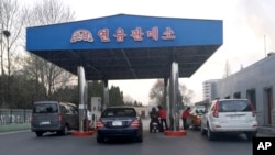 FILE - Cars line up at the pumps at a gas station in Pyongyang, North Korea, April 1, 2016.. Higher prices were a problem in early 2016, but recently an apparent gas shortage is causing the pain at the pump.