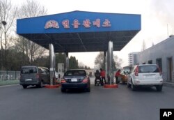 FILE - Cars line up at the pumps at a gas station in Pyongyang, North Korea, April 1, 2016.. Higher prices were a problem in early 2016, but recently an apparent gas shortage is causing the pain at the pump.