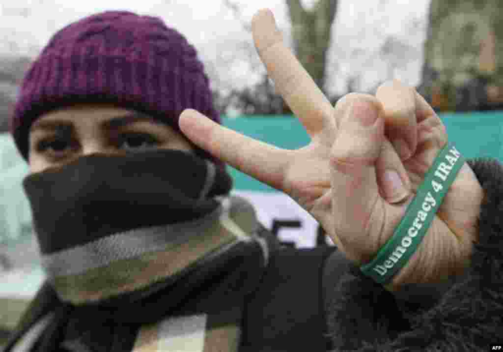 An anti Iranian government protestor demonstrates outside the Iranian embassy in London, Friday, Dec. 2, 2011. Britain's foreign secretary on Wednesday ordered all Iranian diplomats out of the U.K within 48 hours following attacks on the British embassy