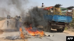 A truck passing a partial roadblock setup by residents as a protest against the Islamist Al-Shabab insurgent group, in Tobanka Buundo in the lower Shabelle region, near the Somalian capital Mogadishu, March 6, 2014.