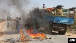 A truck passing a partial roadblock setup by residents as a protest against the Islamist Al-Shabab insurgent group, in Tobanka Buundo in the lower Shabelle region, near the Somalian capital Mogadishu, March 6, 2014.